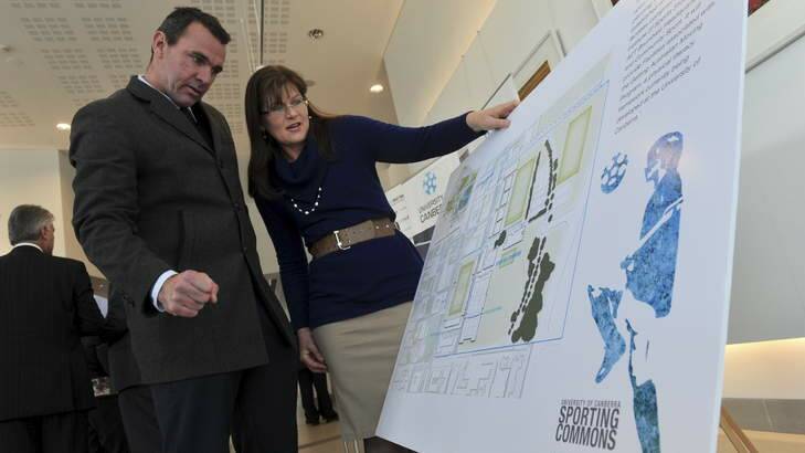 Joe Roff and Kate Lundy look at plans for the Sporting Commons project while at the ACT Labor campaign launch. Photo: Graham Tidy