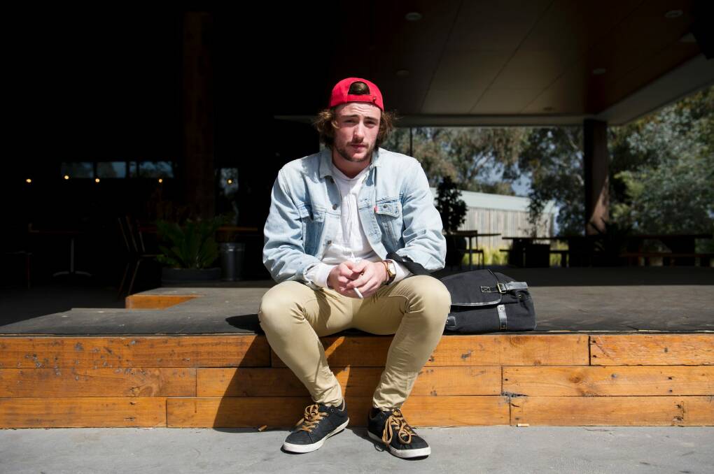 University of Canberra student Luke O'Reilly said smoking areas hadn't been policed in the past.  Photo: Jay Cronan