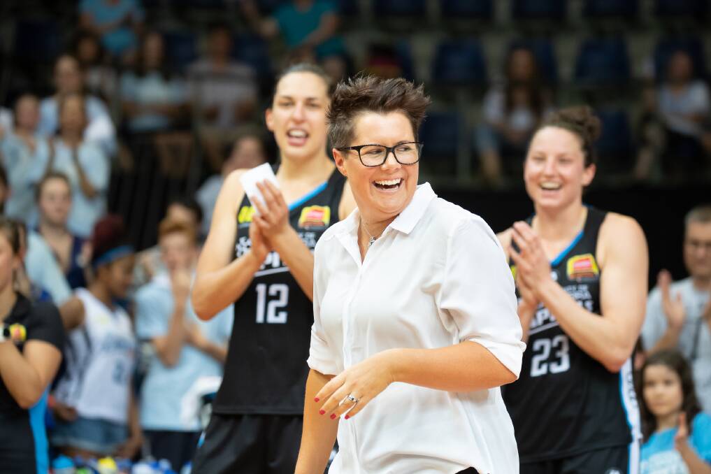 Canberra Capitals assistant coach Bec Goddard walks up to receive her championship ring.  Photo: Sitthixay Ditthavong
