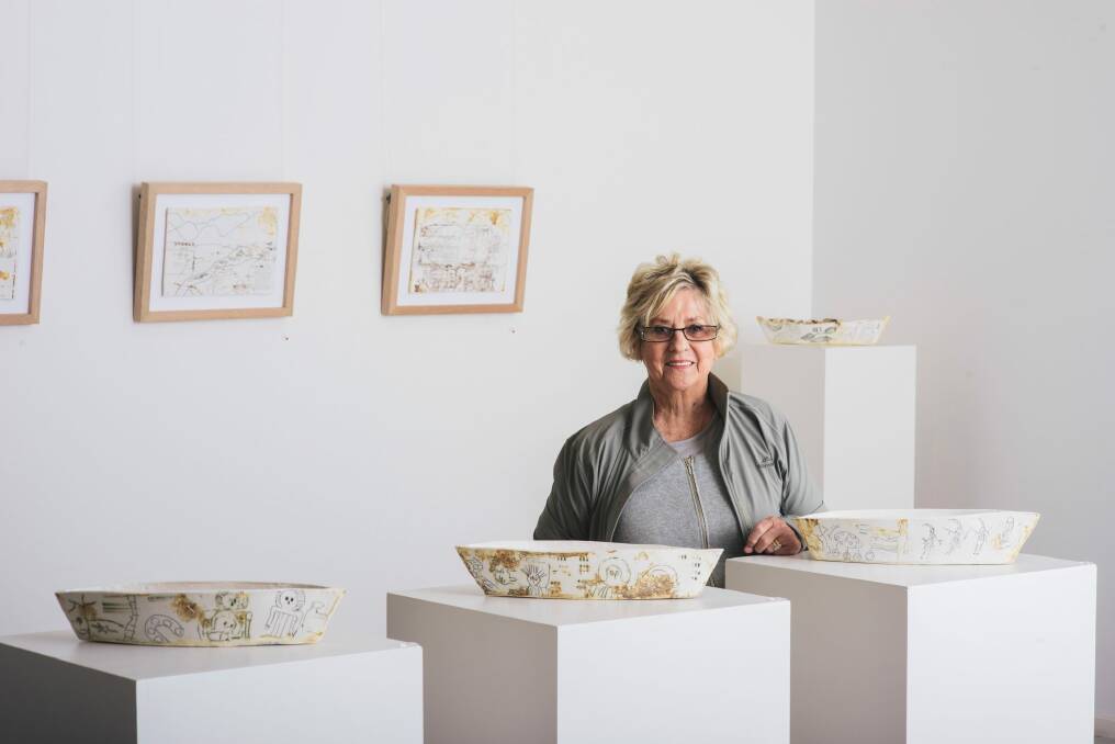 Artist Anita McIntyre with her work on show at Beaver Galleries in Deakin. Photo: Rohan Thomson
