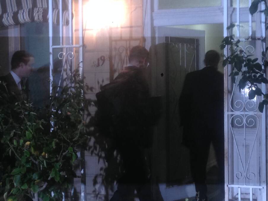AFP agents raid a Labor staffer's house in Melbourne on May 19. Photo: Nick Toscano