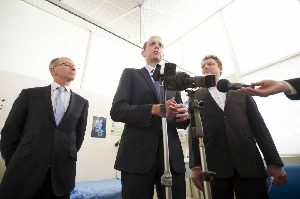 Health Minister Simon Corbell is joined by ACT Chief Health Officer Dr Paul Kelly and ACT Medicare Local Chair Dr Martin Liedvogel to launch the 2015 Winter Plan. Photo: Jay Cronan