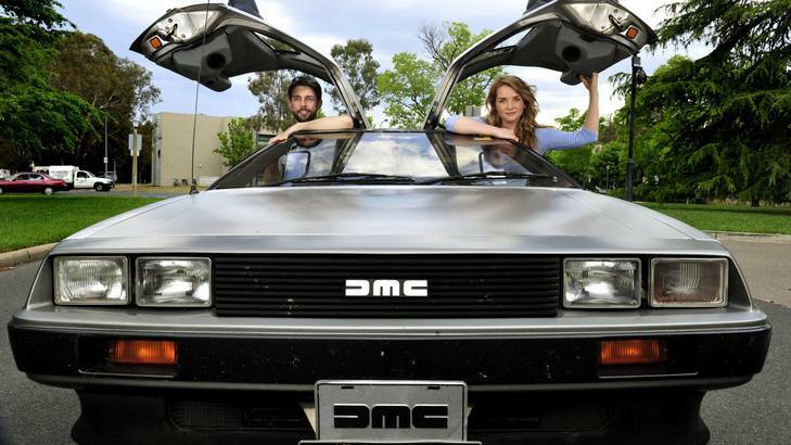 L-R Christian Doran and Sarah Mason with a DeLorean car from Back To The Future outside the National Film and Sound Archive. Photo: Melissa Adams