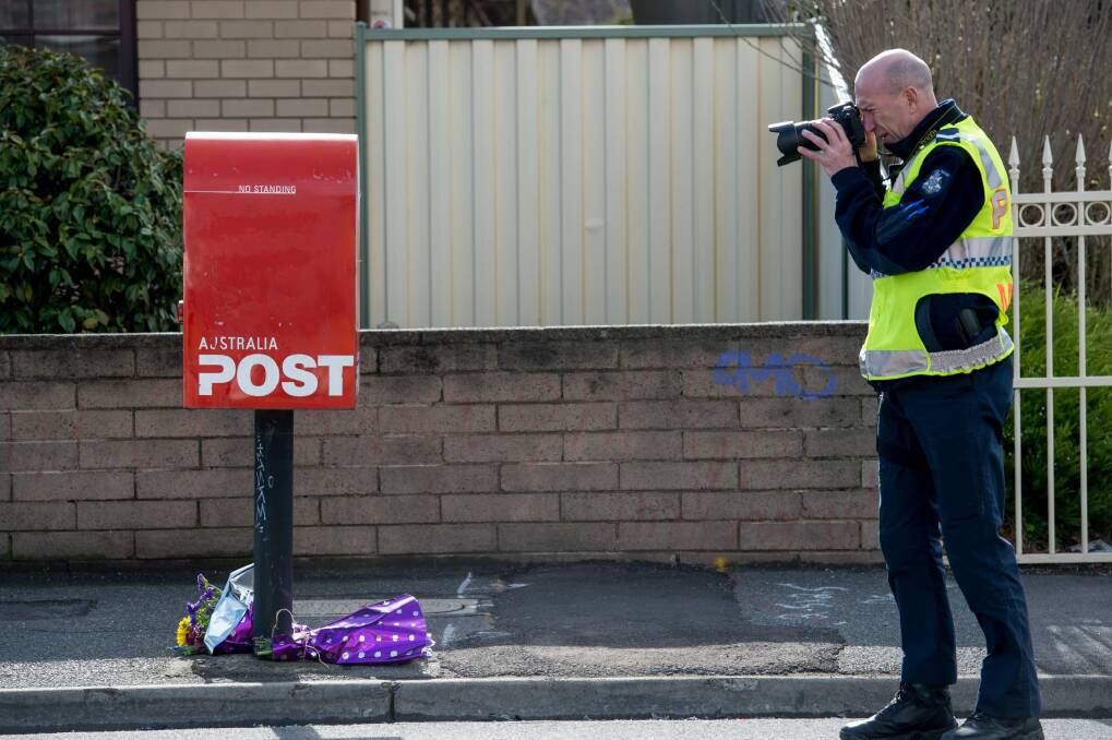 Police investigate the death of cyclist Peter McGuffie in West Footscray.   Photo: Penny Stephens