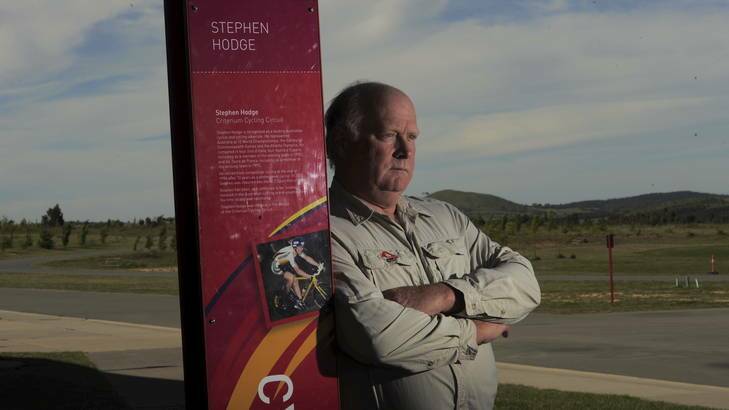 Mountain Bike Australia president Russell Baker at Stromlo Forest Park next to a  tribute to Australian representative cyclist, Stephen Hodge. The criterium circuit is named in Hodge's honour. Photo: Graham Tidy
