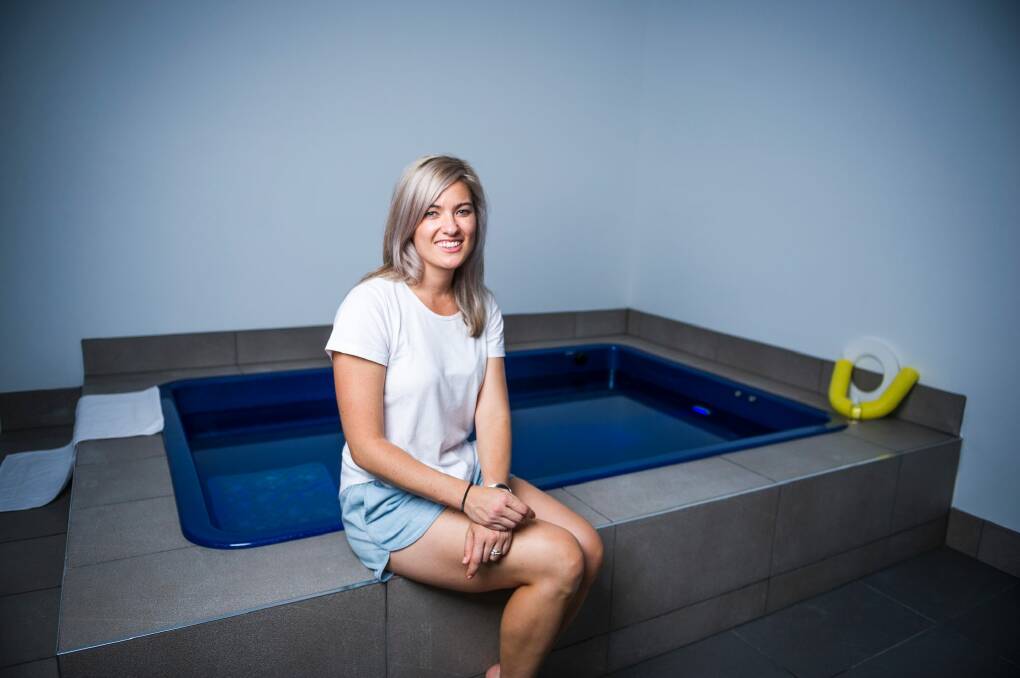 Astral Float Studio owner Sarah Tisdell with the fully accessible float bath for people with mobility issues or claustrophobia. Photo: Dion Georgopoulos