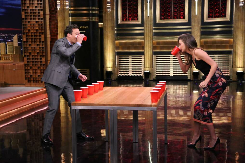 Jimmy Fallon and Miranda Kerr playing Flip Cup during her recent interview on The Tonight Show. Kerr lost in a nail-biting game which saw her chug beer, then flip a cup upside down.