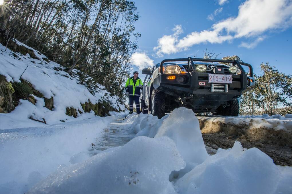 Transport Canberra and City Services? Project Officer Adam Melville looks after icy or snow affected roads in the Namadgi National Park area (near the Mount Franklin chalet site). Photo: karleen minney