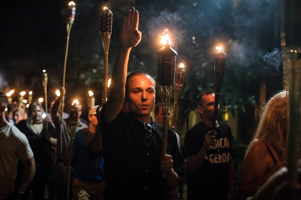 A white supremacist gives a Nazi salute in Charlottesville. White supremacy is on the rise in the US and many western nations. Photo: New York Times