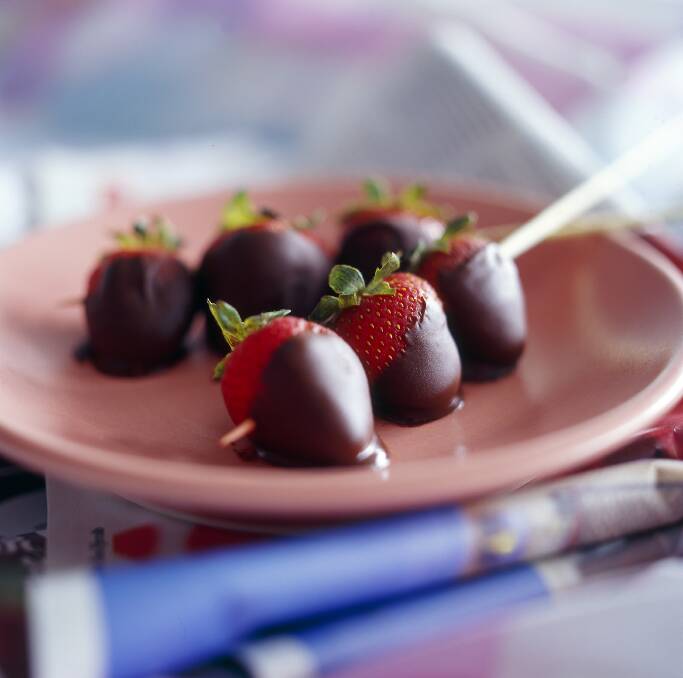 Chocolate-dipped strawberries fresh from the garden are one of life's simple pleasures. Photo: Jennifer Soo