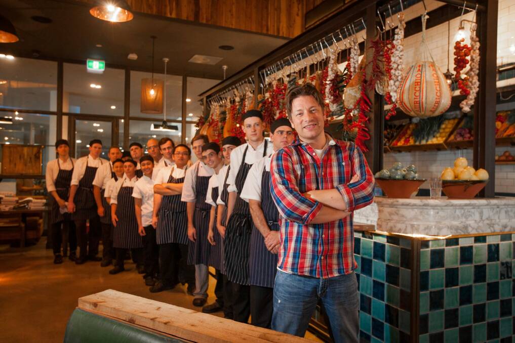 Chef Jamie Oliver - with a queue of his own chefs - during a visit to his Canberra Jamie's Italian restaurant last year.  Photo: Katherine Griffiths
