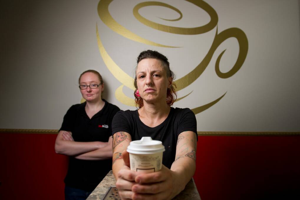 Jessica Klobucar and Jolene Mifsud with one of the takeaway coffee cups. Photo: Jay Cronan
