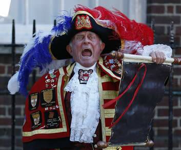 Tony Appleton, a town crier,  announces the birth of the royal baby, outside St. Mary's Hospital on July 22.