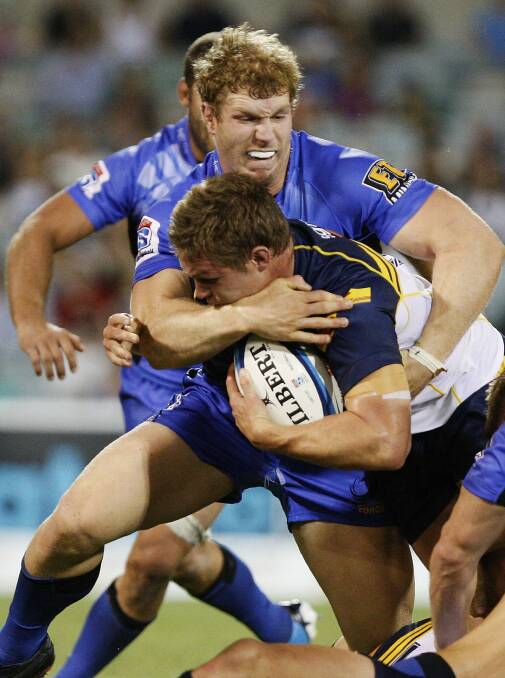 David Pocock tackles Michael Hooper in the 2012 Super Rugby season. Photo: Getty Images
