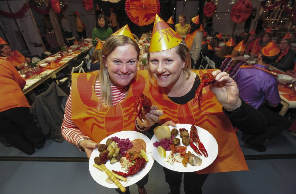 IKEA fans are treated to a traditional lobster party ahead of the store's official opening later this year. Virginia Yabsley (left) and Chedal Baesjou, both of Harrison, tuck in. Photo: Graham Tidy