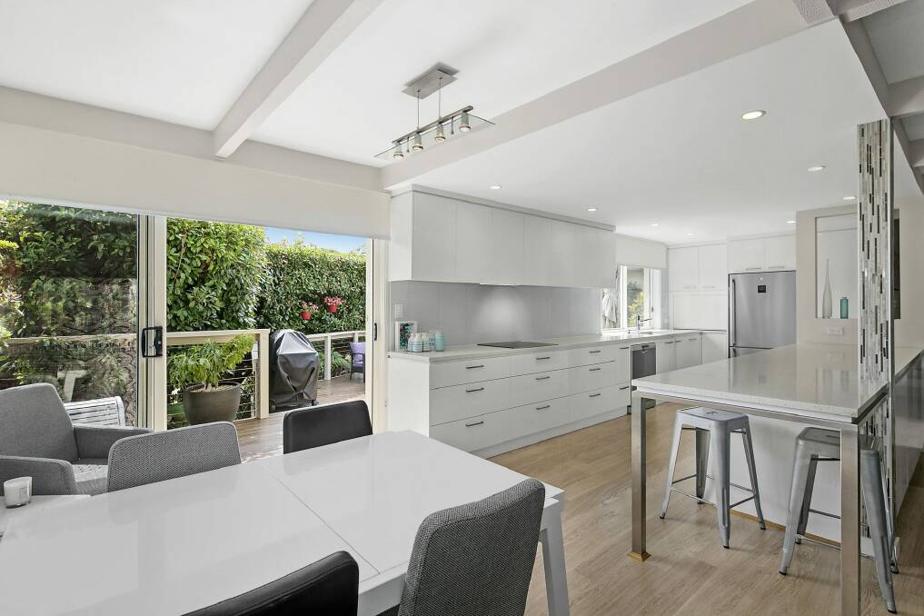 An open-plan living, dining and kitchen area is the property's central hub.  Photo: Supplied