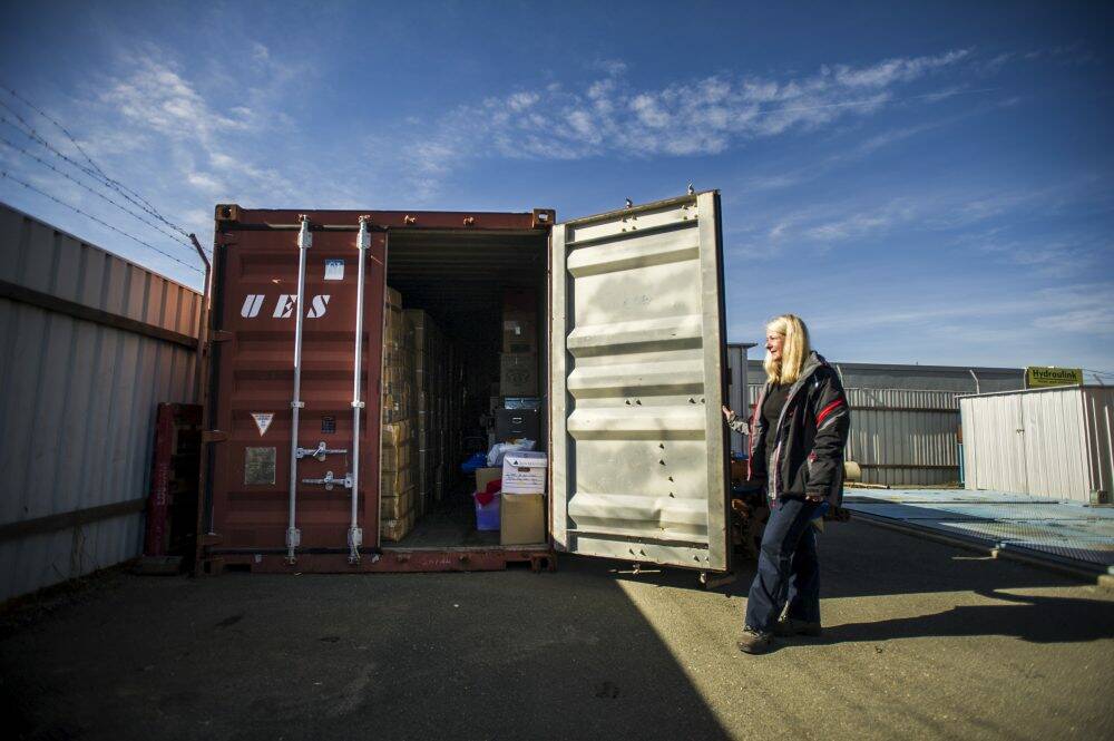 Cooma Diesel's Jane Lynch opens the door of their shipping container which they use for storage at their business in Fyshwick. Photo: Rohan Thomson