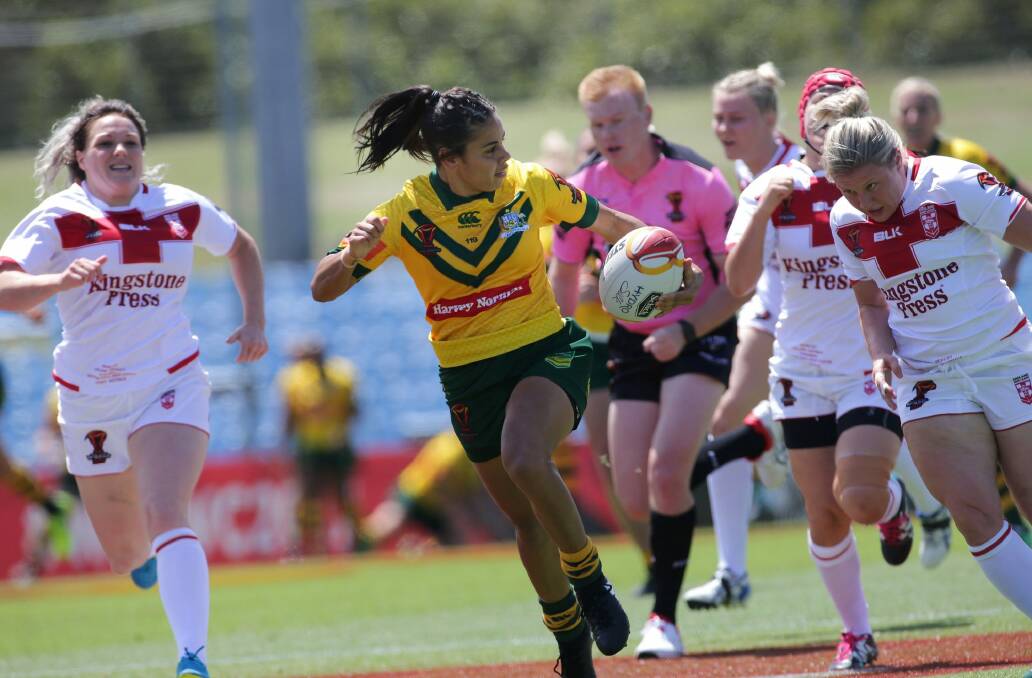 No contest: Nakia Davis Walsh races clear of the England defence to score. Photo: John Veage