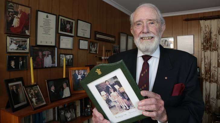 Former PSCC [Protective Security Co-Ordination Centre] member David Evans with a signed photo of Prince Charles and Princess Diana at his Chapman home. Photo: Jeffrey Chan