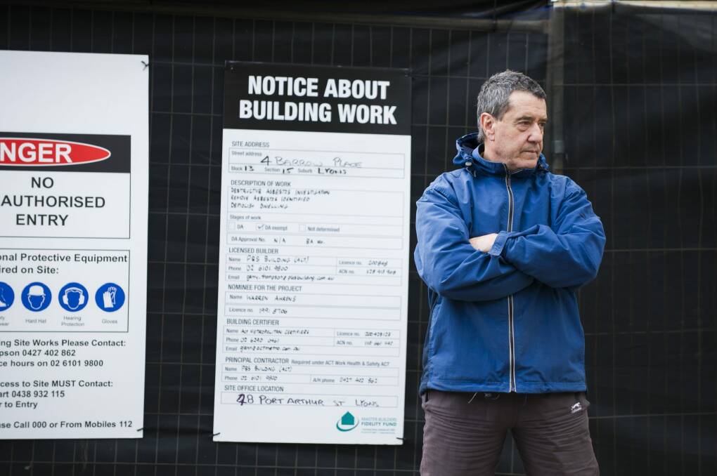 Leo Carvalho of Lyons was concerned about unsafe Mr Fluffy demoloitions and protested outside his neighbour's home on Thursday morning. 
11 May 2016
Photo by Rohan Thomson
The Canberra Times Photo: Rohan Thomson