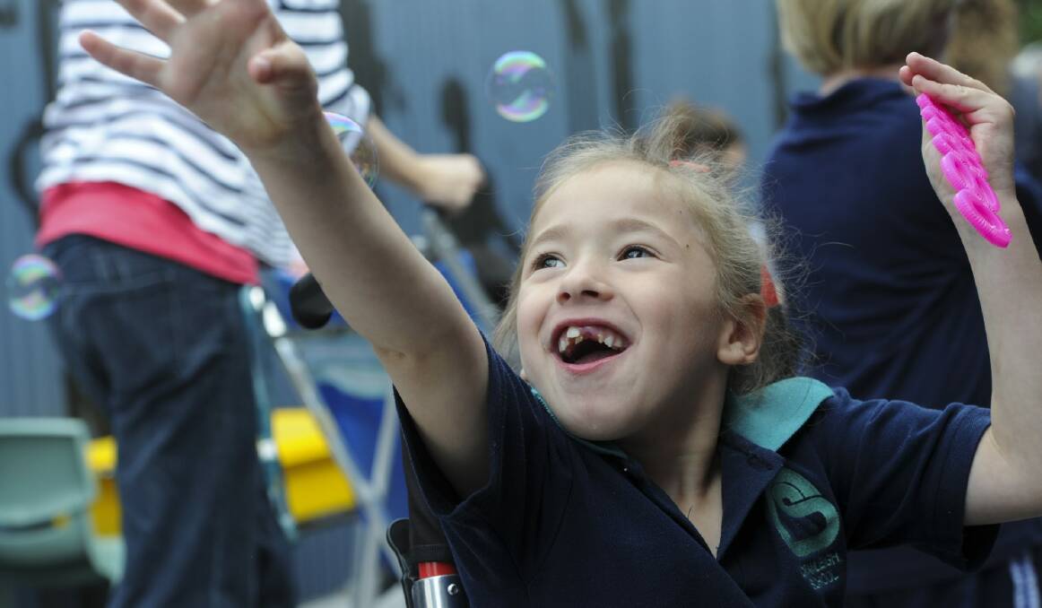 At the opening of the sensory space at Cranleigh School in Holt, Lovina Micallef, 6, is intrigued with the bubble blowing activity.  Photo: Graham Tidy