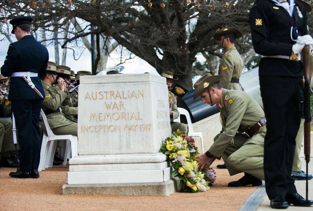 Army chief Lieutenant General Angus Campbell lays a wreath at a ceremony to mark the 70th anniversary of the Victory in the Pacific, or VP Day, at the Australian War Memorial. Photo: Elesa Kurtz