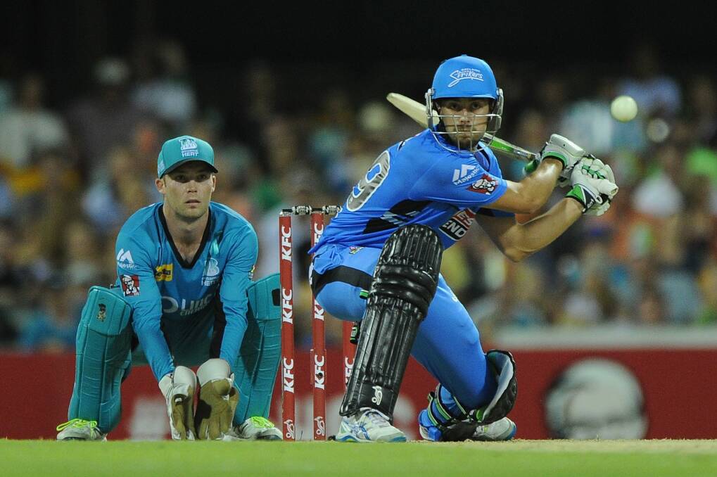 Alex Ross playing a trademark sweep for the Adelaide Strikers against the Brisbane Heat, the team he's set to join this summer.  Photo: Matt Roberts