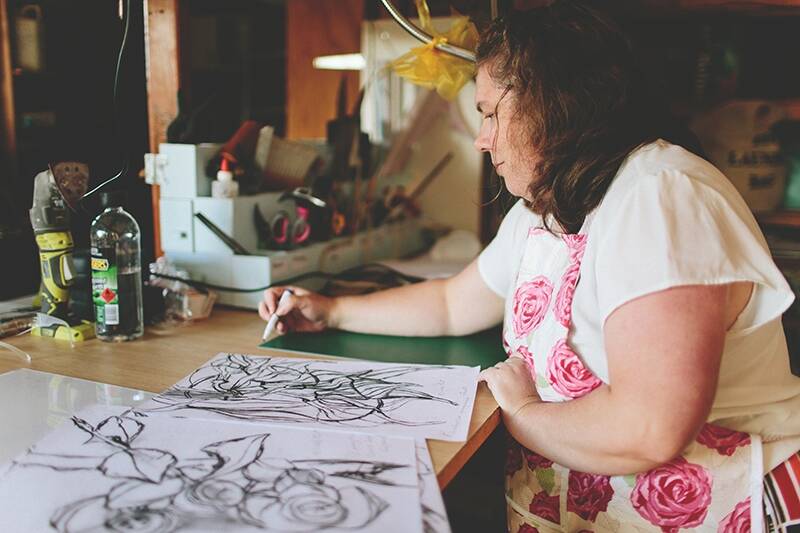 Artist Kim Bagot-Hiller with her botanical drawings. Photo: Supplied