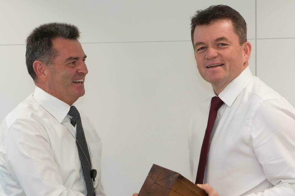 AFP Commissioner Andrew Colvin (right), who also participated in this year's Movember for the first time, presents Commander Mick Chew (left) with the Best Mo award. With both men now clean-shaven, we hope the prize included some nice Old Spice aftershave or similar. Photo: Supplied