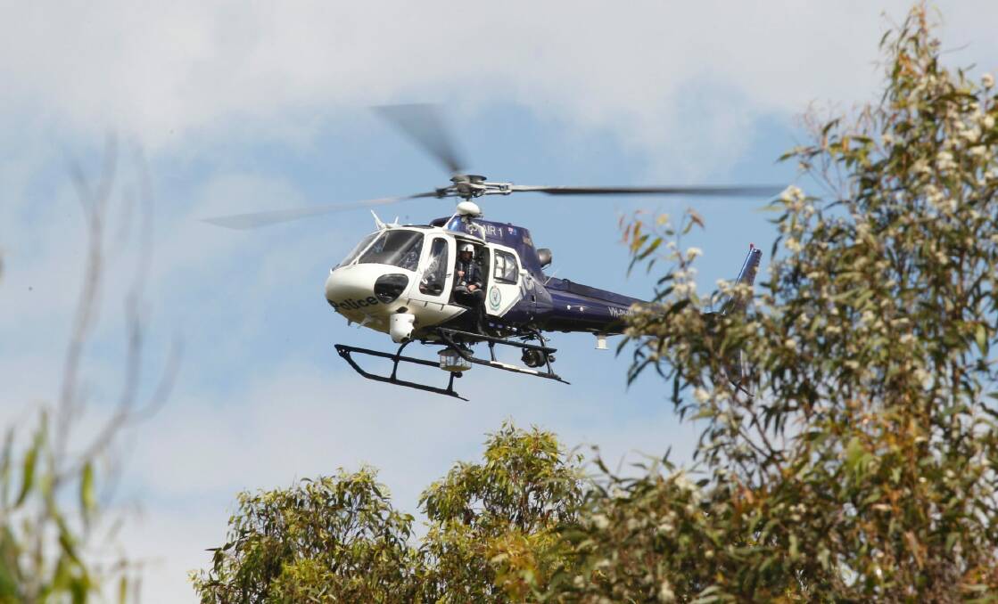A police helicopter is aiding in the search for one man and three children missing from Batemans Bay.  Photo: Darren Pateman
