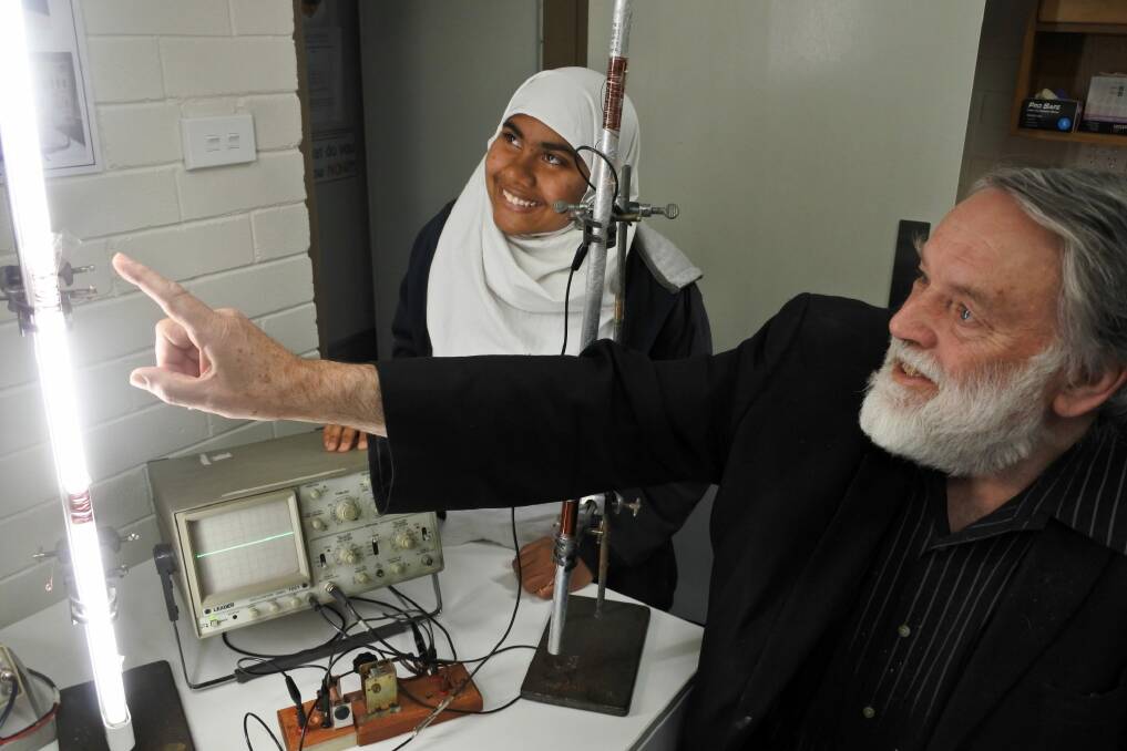 Melrose High School year 9 student Shamima Islam paired up with physicist John Rayner to create a plasma-powered antenna. Photo: Stephen Jeffery