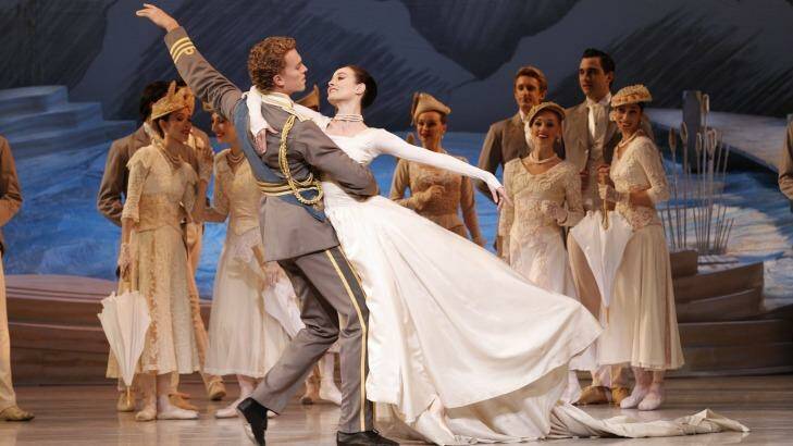 Adam Bull and Amber Scott, front, in the wedding scene from Graeme Murphy's  2013 <i>Swan Lake</i>. Photo: Jeff Busby