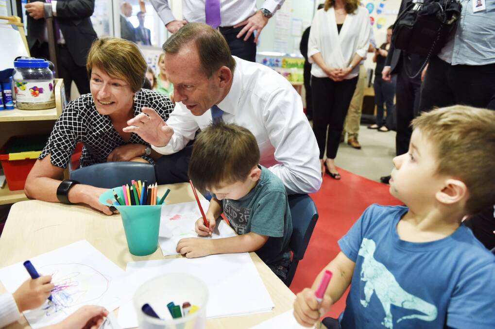 Prime Minister Tony Abbott and wife Margie meet kids at the Little Pines Childcare Centre in Sydney on Tuesday. Photo: Nick Moir