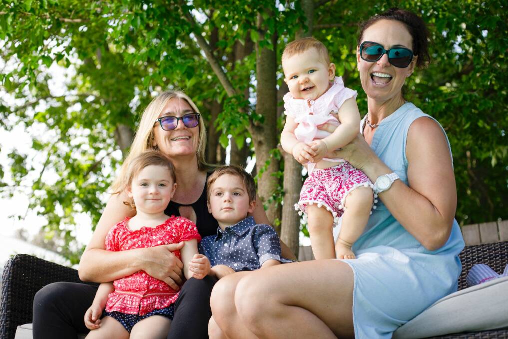 Carrie Graf and Camille Chicheportiche with their four-year-old twins Charli and Bentley, and seven-month-old Soli.  Photo: Sitthixay Ditthavong