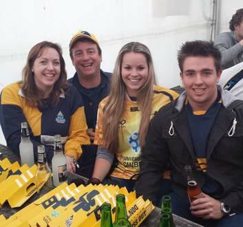 Caitlyn Taylor, 20, (centre) who flew in from Los Angeles to see the Brumbies take on the Chiefs in Waikato. Photo: Chris Dutton