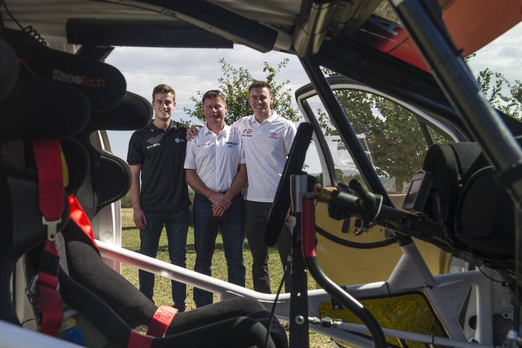 Rally drivers, Lewis and Harry Bates with dad Neal (centre) at the National Capital Rally launch. Photo: Elesa Kurtz