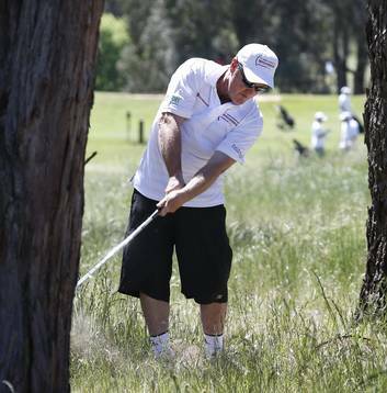 Bernard Maloney hits out of the rough on the first hole during the Terry Campese Foundation Golf Day. Photo: Jeffrey Chan