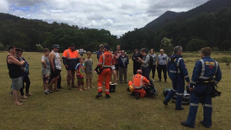 Essential supplies are delivered to a group of campers stranded by floodwaters in the Deua National Park. Photo: SES