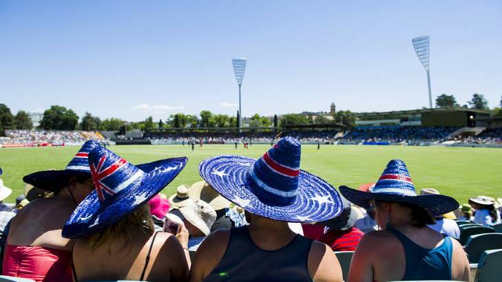 Spectators bake in the sun at Manuka Oval for the Prime Minister's XI cricket match. Photo: Rohan Thomson