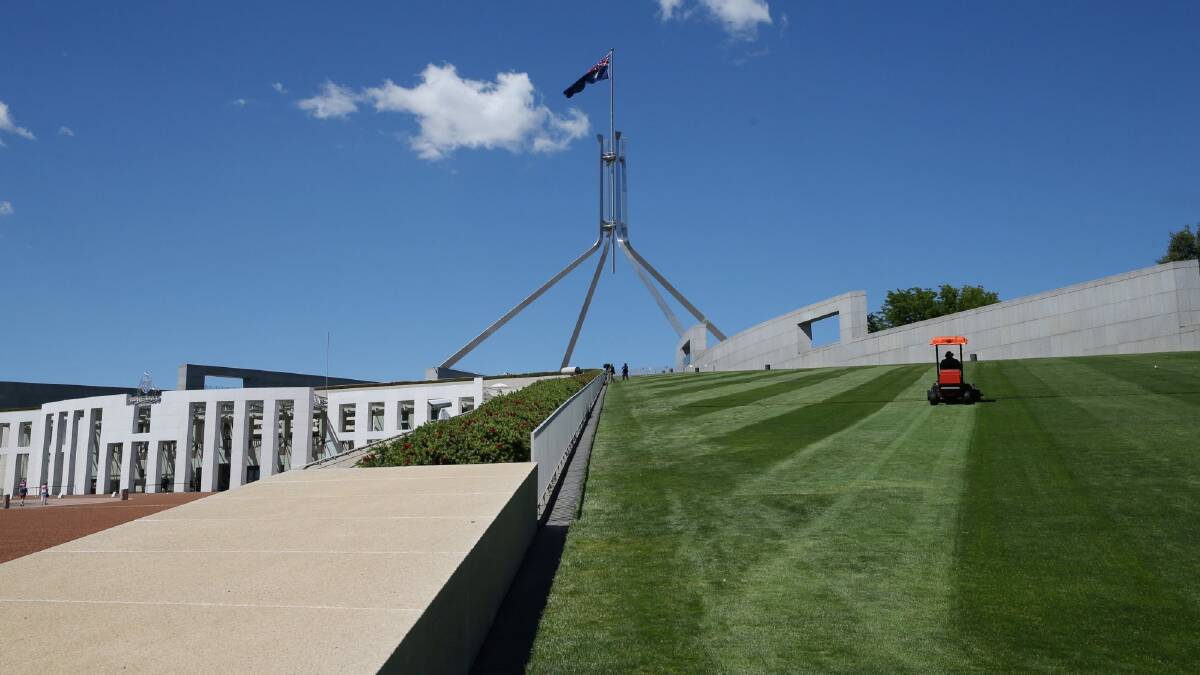 Instead of a berm or moat, a new fence will cut across the lawns at Parliament House. Photo: Andrew Meares