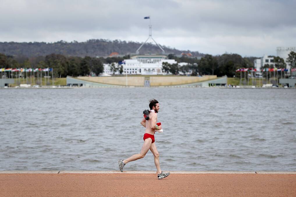 One of 70 runners who braved the cold for this year's Santa Speedo Shuffle, raising funds for Cystic Fibrosis.   Photo: Jeffrey Chan