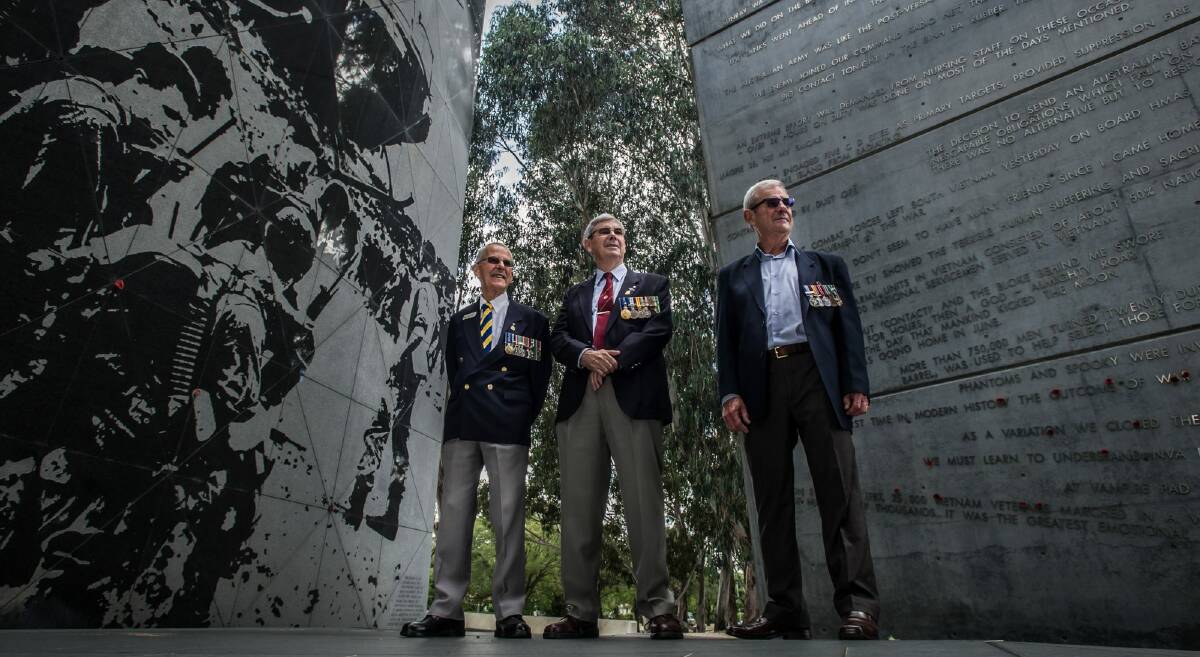Three of Canberra's Vietnam veterans meet at the Vietnam War memorial. From left: Jack Aaron, Peter Dinham and Greg Kennett. Photo: karleen minney