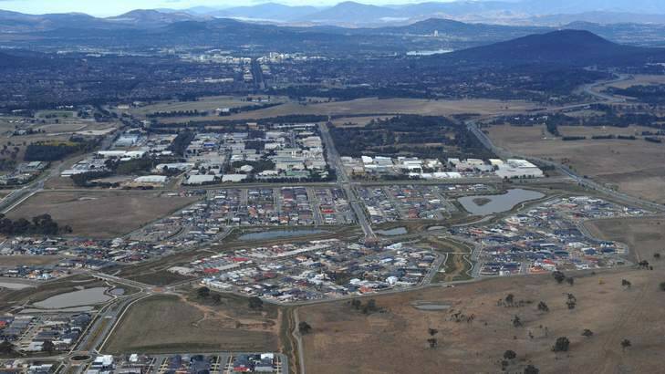 Aerial photograph of the suburb of Franklin in the foregound, with Mitchell in mid distance and Canberra City in the background. Photo: Graham Tidy