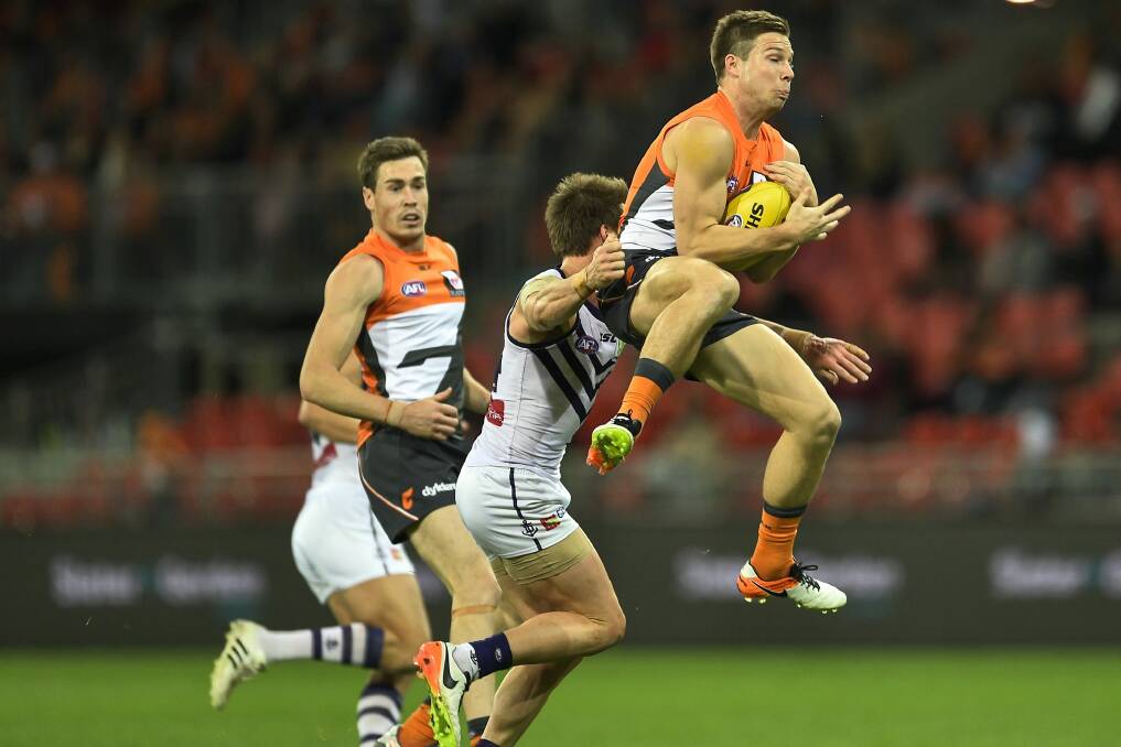 Chipping in: Toby Greene marks on the lead in front of Docker Lee Spurr. Photo: Getty Images