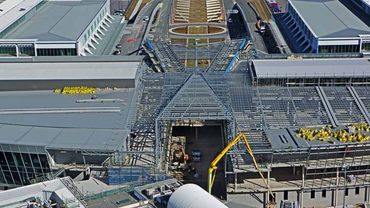 Steel framework shows the shape of a new atrium that will sit between the new terminals. Photo: Supplied