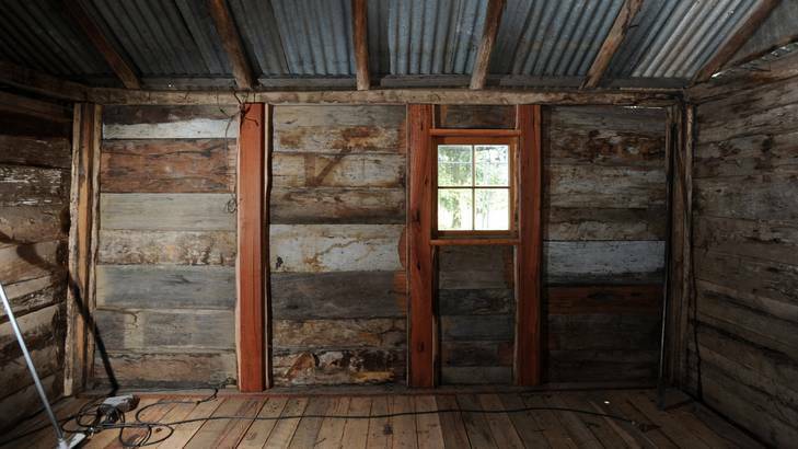 Bob Moon and Uwe Petersohn are renovating the historic Tralee Slab Hut in Hume. Photo: Graham Tidy