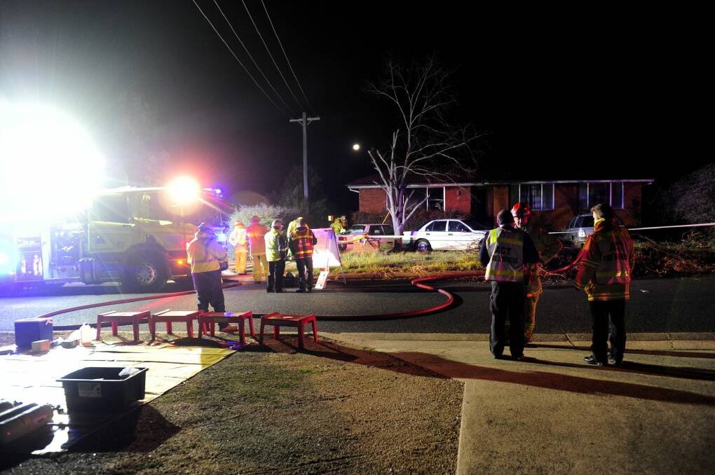 ACT Emergency Services investigate a house fire on Neumayer Street in Page. Photo: Melissa Adams  