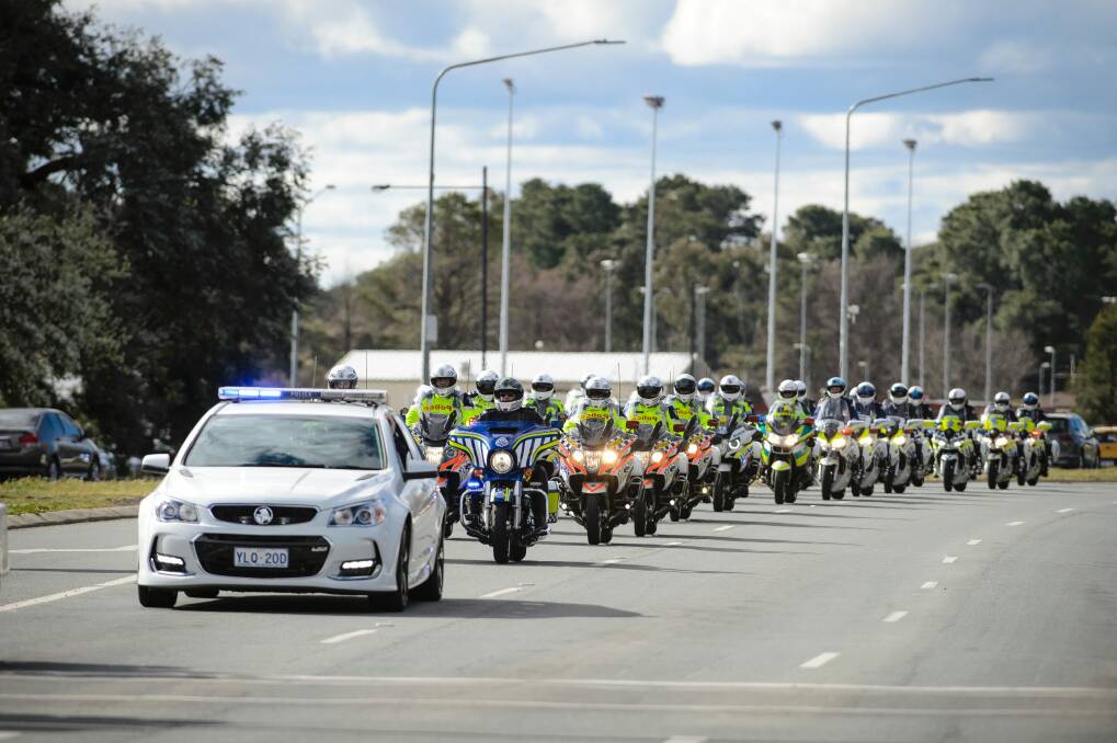A long convoy of motorbikes makes its way down Northbourne Avenue during the 2017 Wall to Wall Ride for Remembrance.  Photo: Sitthixay Ditthavong