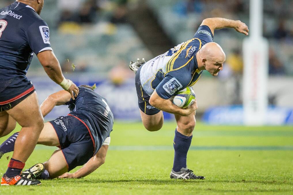 Hooker Stephen Moore of the ACT Brumbies stumbles in the slippery conditions. Photo: Matt Bedford