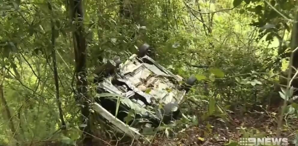 The car came to a rest upside down, with the driver managing to crawl out from the wreckage. Photo: Nine News Queensland